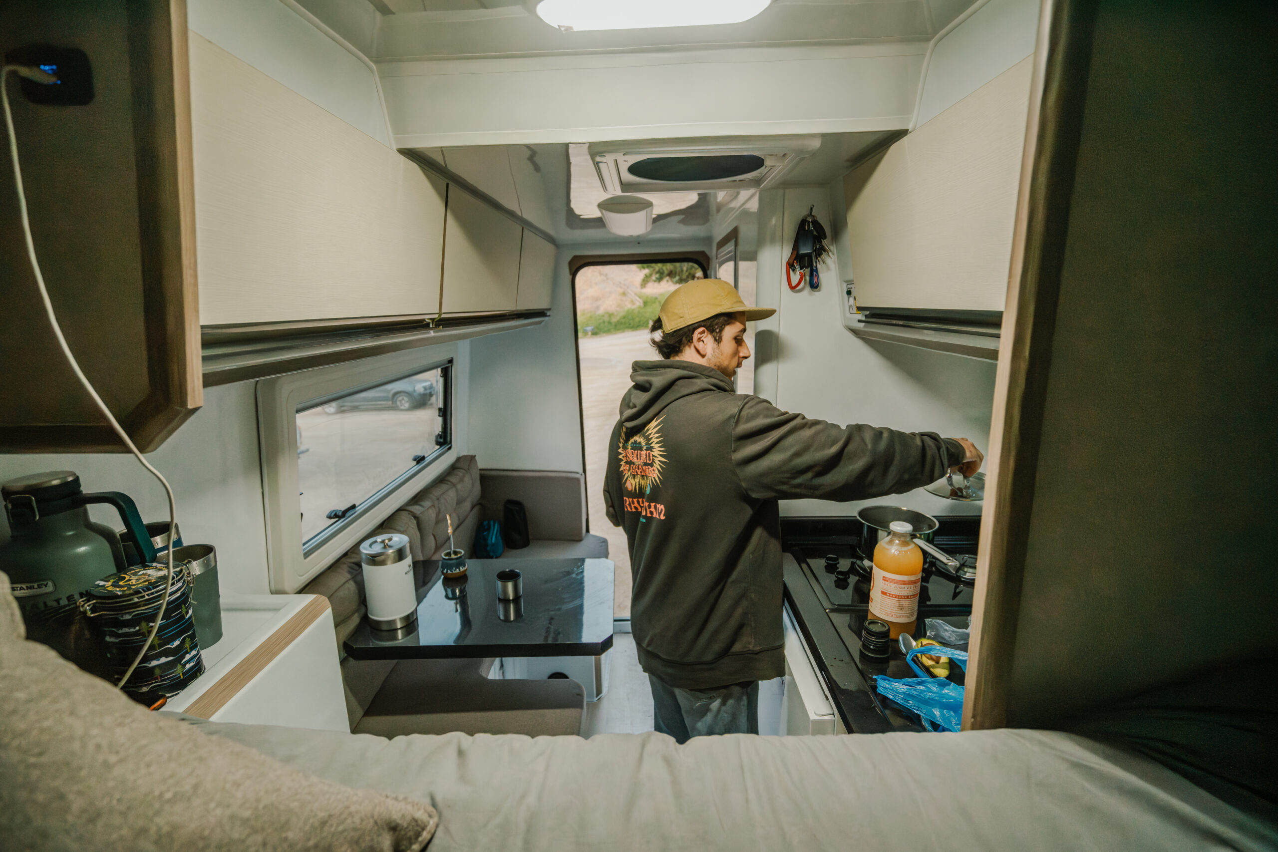 9. 180 Sur Campers Rental - Duaron Zion camper 4x4 - interior - bed view -kitchen- table area
