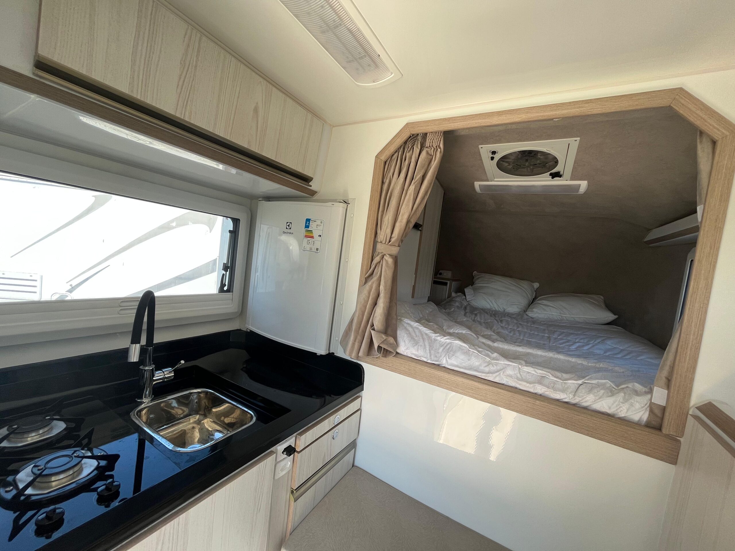 13. 180 Sur Campers Rental - Duaron Roam (king) camper 4x4 - interior - kitchen & bed area